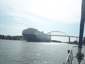 The large ship coming alongside in the canal.