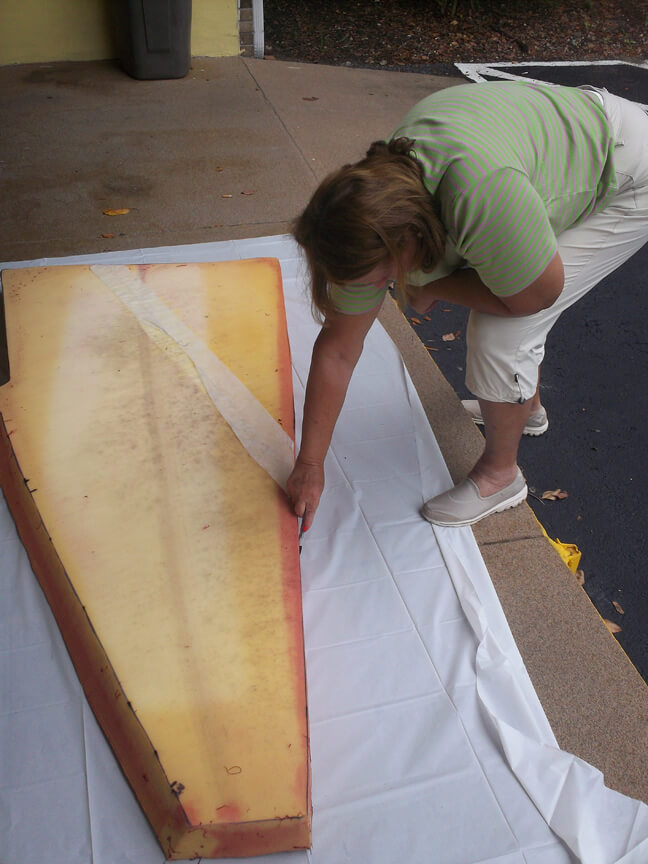 Mom outlining and measuring the v-berth cusion