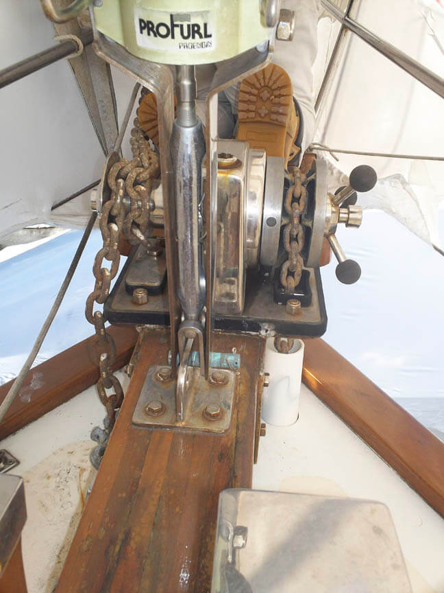 The windlass with the gasket in question just visible...and the boots of our surveyor, Phil