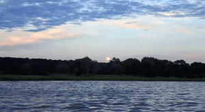 The moon rising over the marsh along the Connecticut.