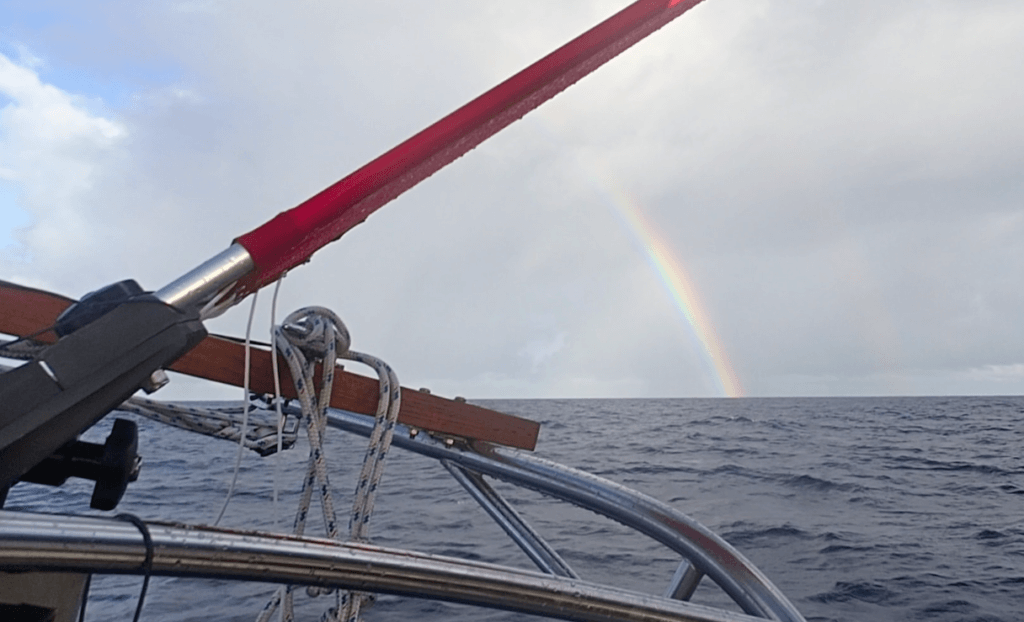Windvane and rainbow from the cockpit.
