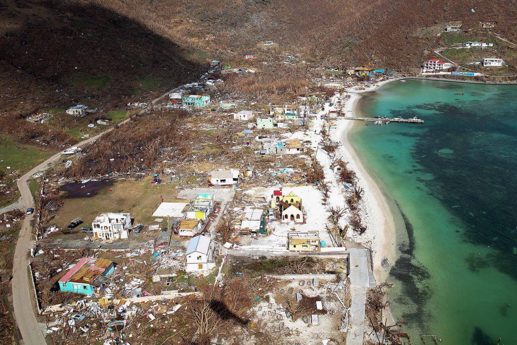 Great Harbour with extensive damage to the buildings and denuded vegetation